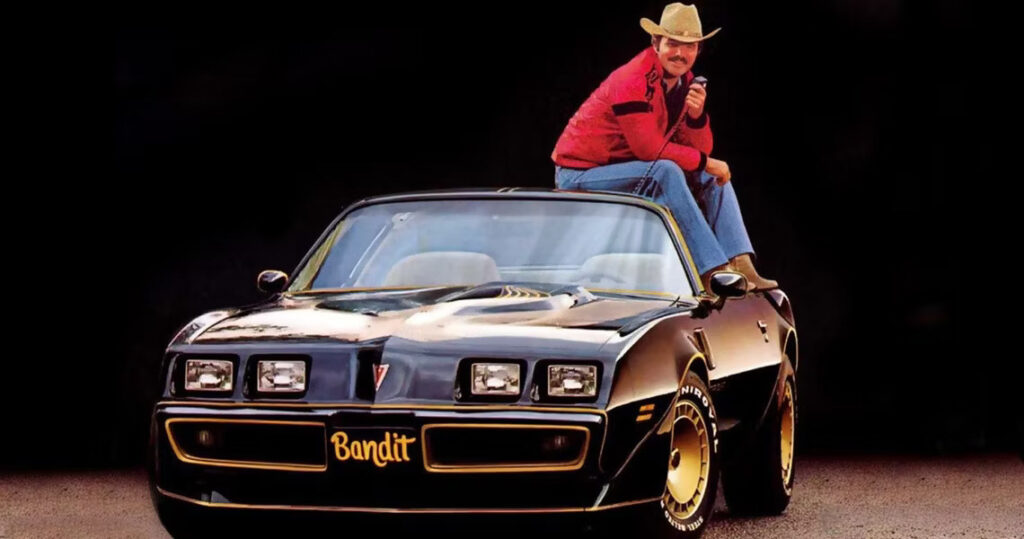 Burt Reynolds on his Pontiac Firebird Trans Am from Smokey and the Bandit