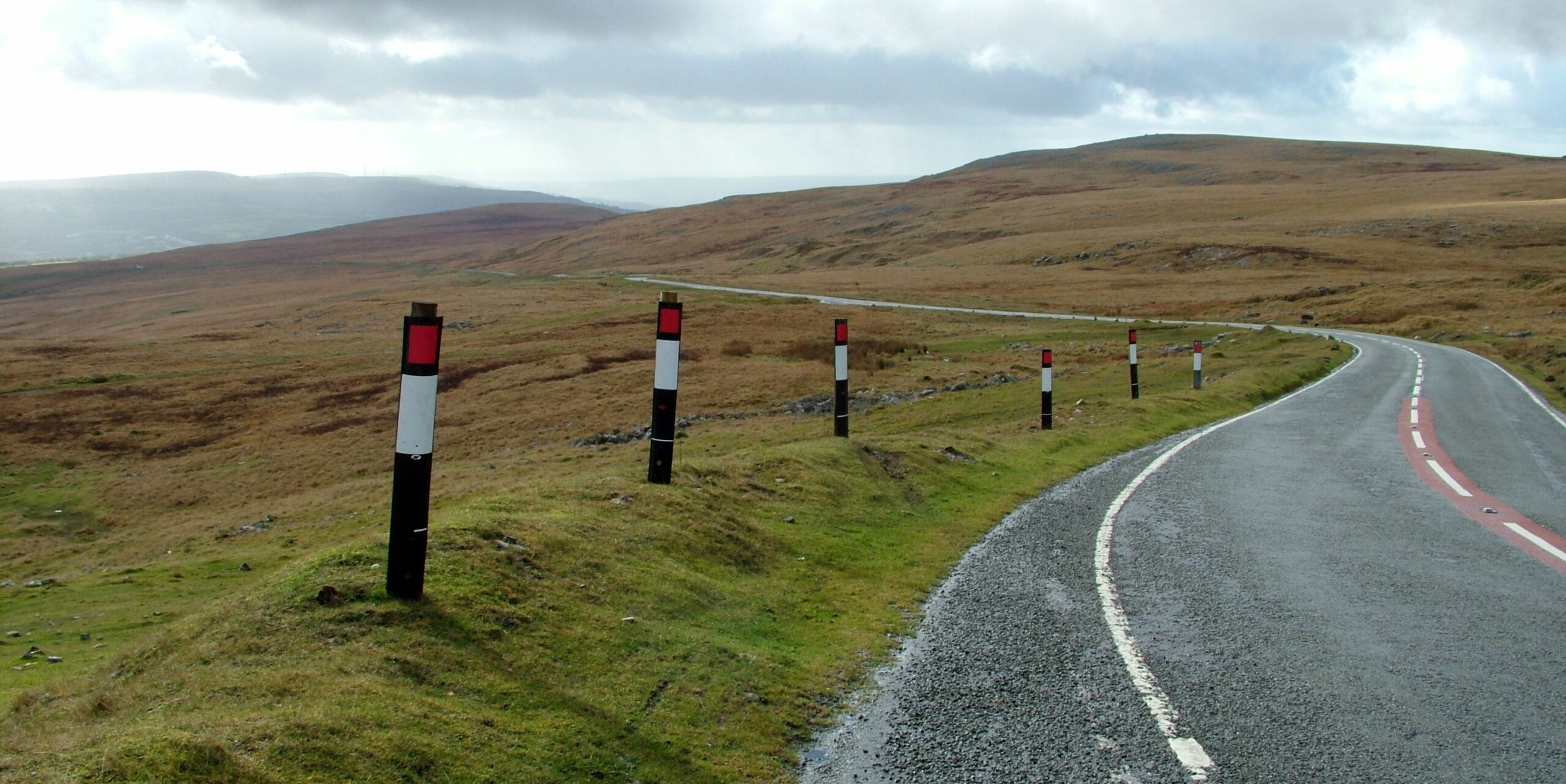 Black Mountain Pass road cutting through open Welsh scenery