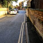 Can you park on a single yellow line? Read the sign, not the paint